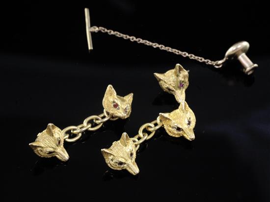 A pair of 1990s 9ct gold and gem set of fox head cufflinks and a similar stud.